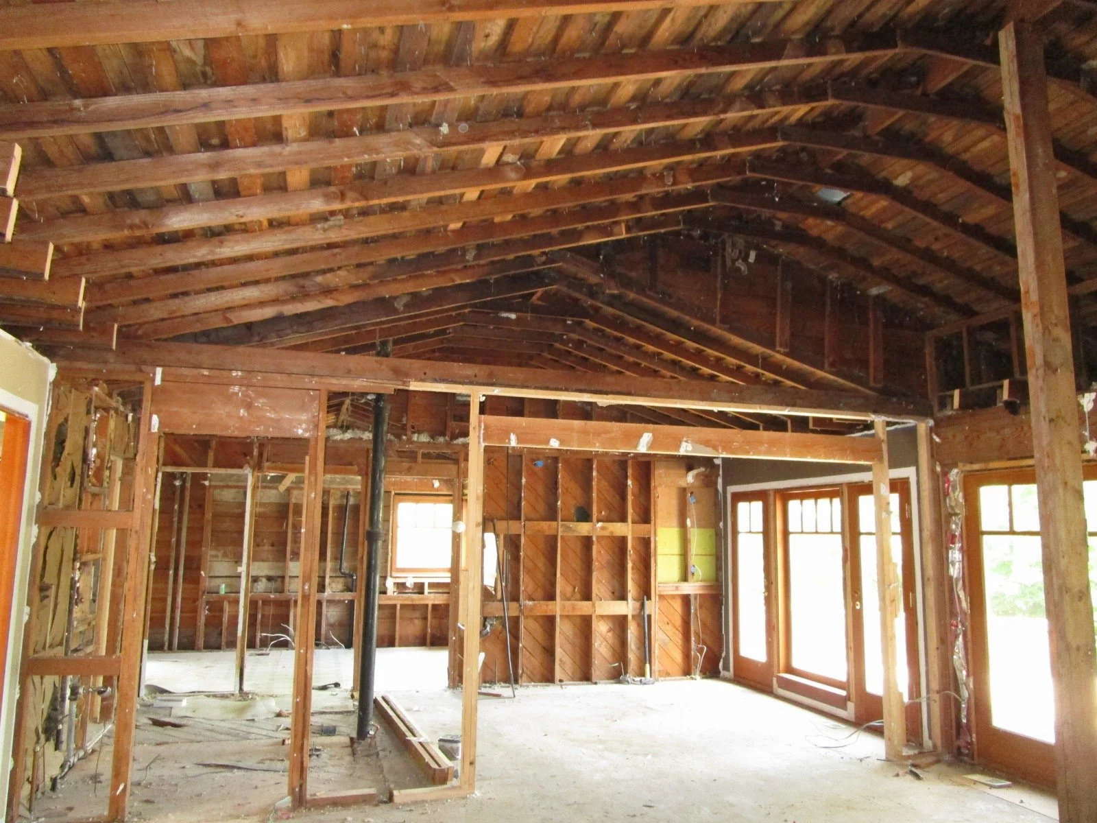 View from the Living Room to the Dining Room and Kitchen way beyond. This will all get opened up.