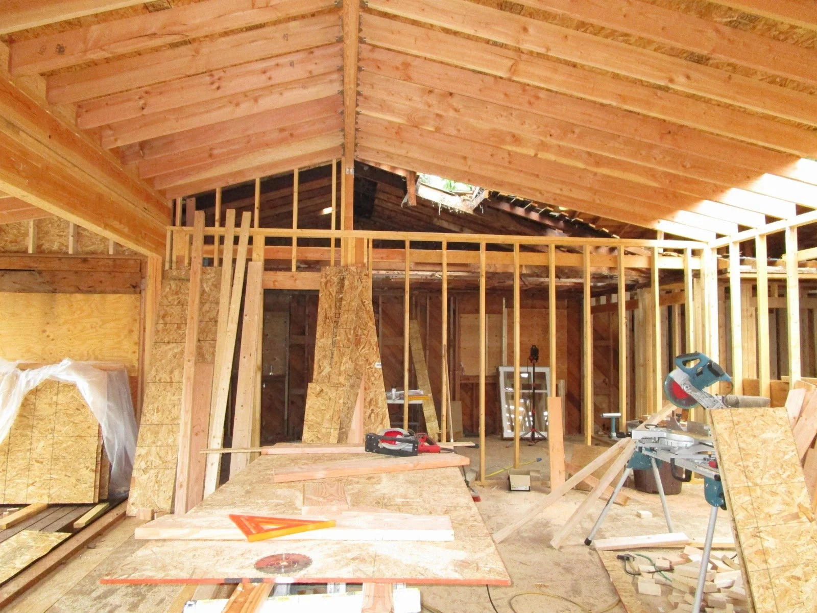 Living room with higher framed ceiling.