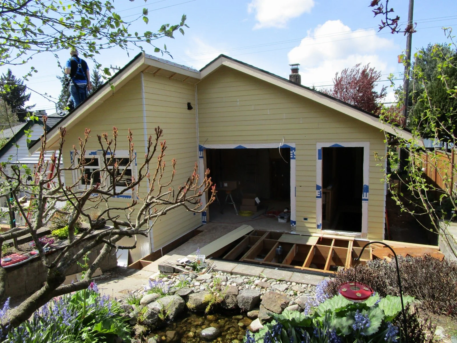 The new dining room and exterior deck will have a great view of the back yard garden.