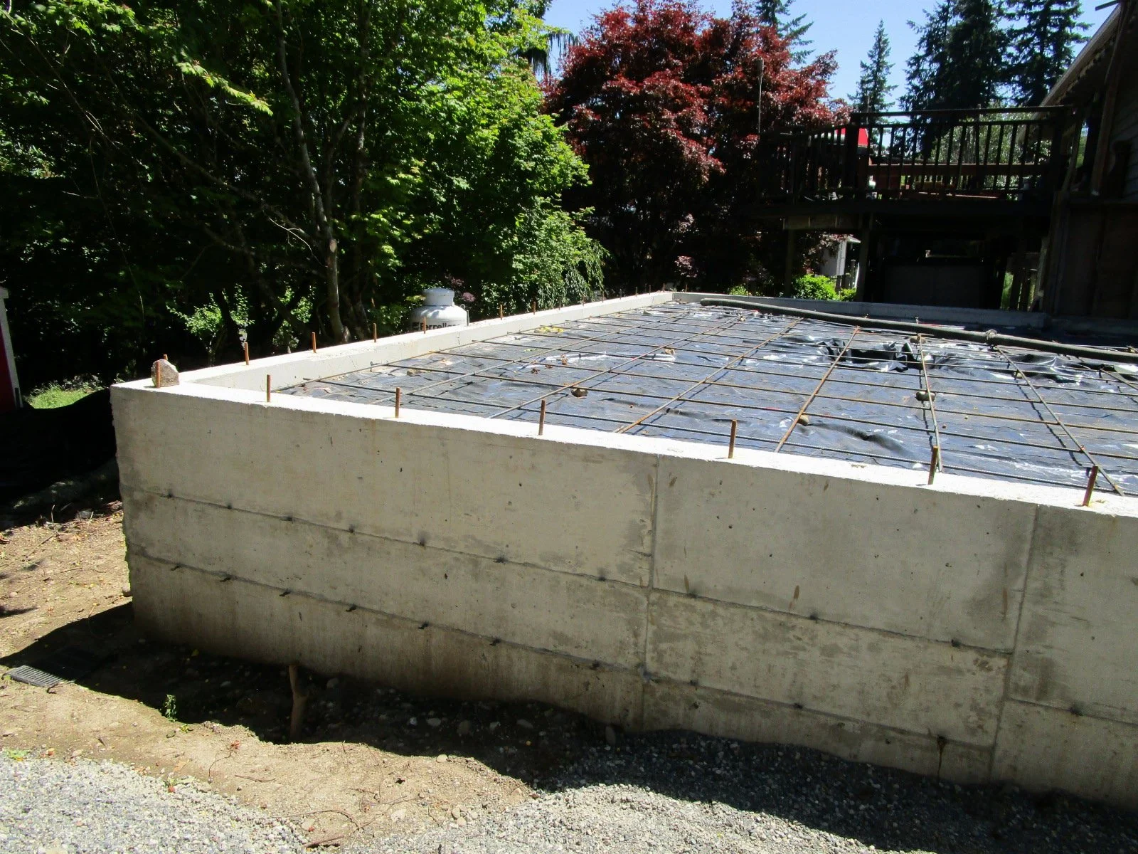 Horizontal rebar grid set for concrete floor.