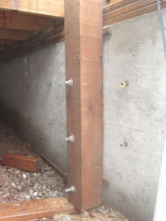 To stiffen the columns we bolted them to the concrete wall that the new stairs are built against.