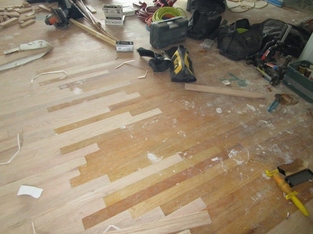 New hardwood is blended into the existing hardwood areas.