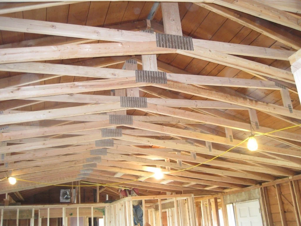 Eventually all of the scissor trusses are placed, and the old ceiling framing is removed.