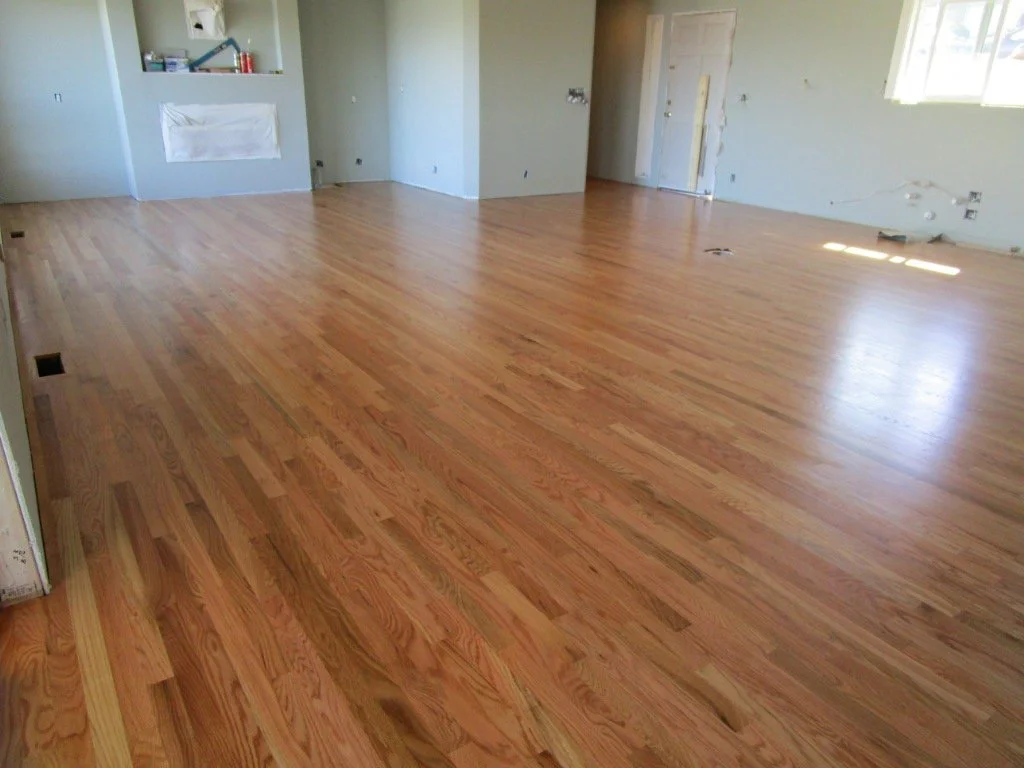 After refinishing the hardwoods, the new blends perfectly with the existing flooring.