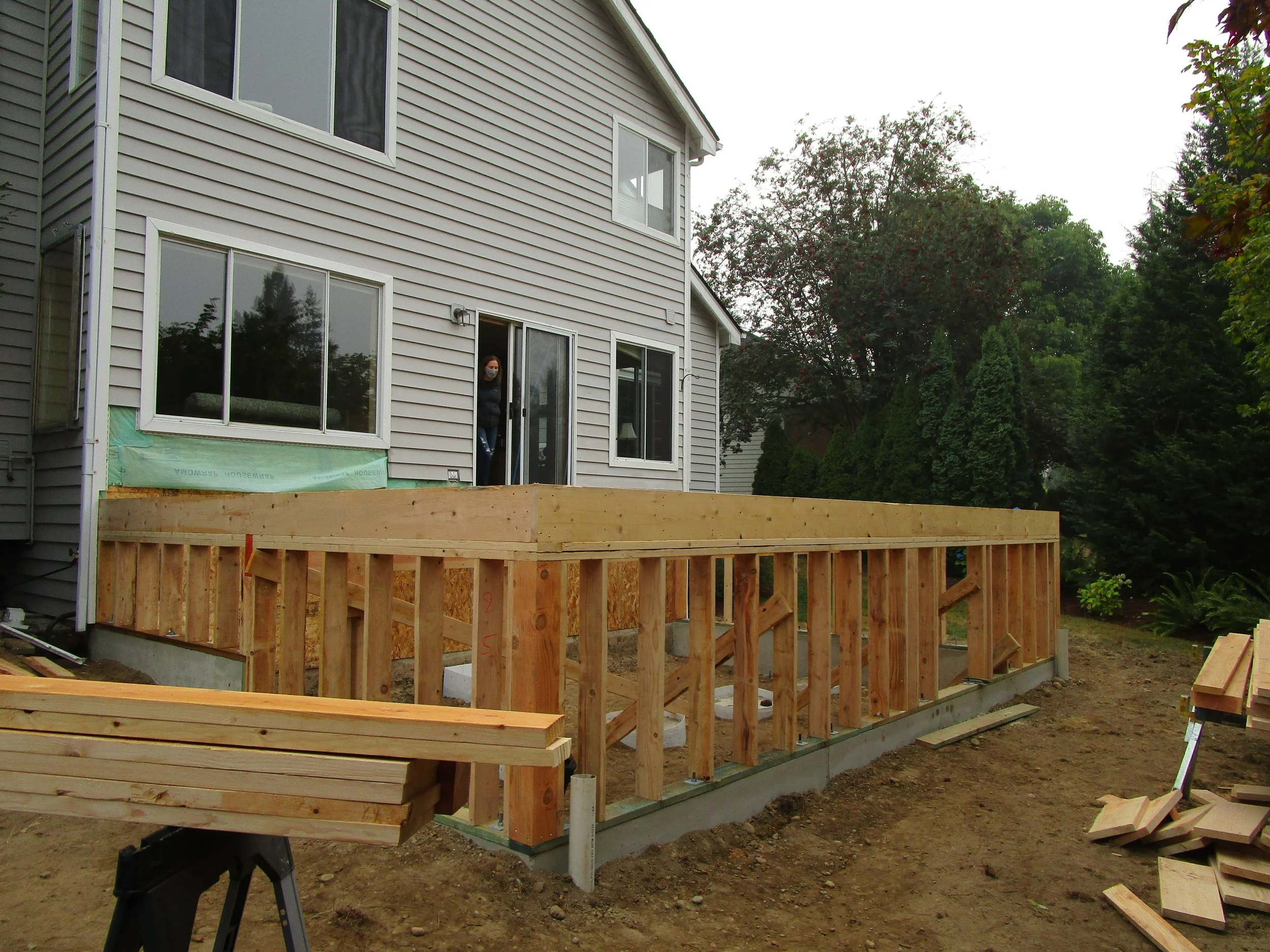 Concrete foundation is in and floor framing has started.