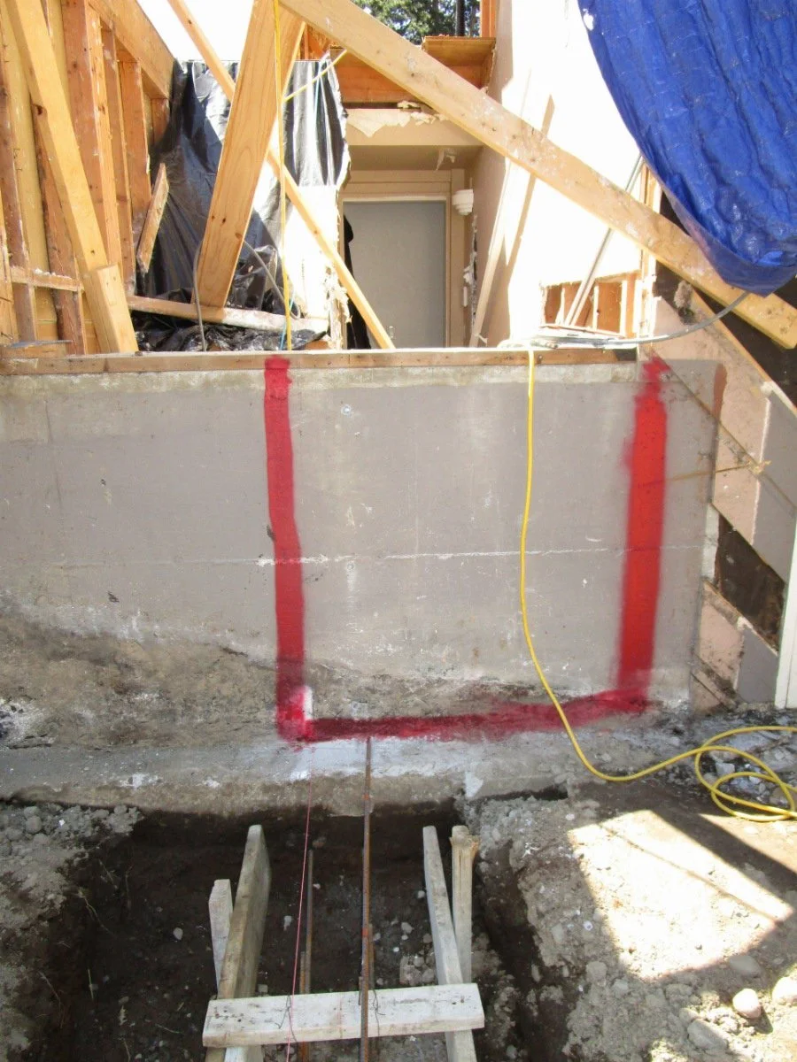 Location of a concrete saw cut for a future stairwell.