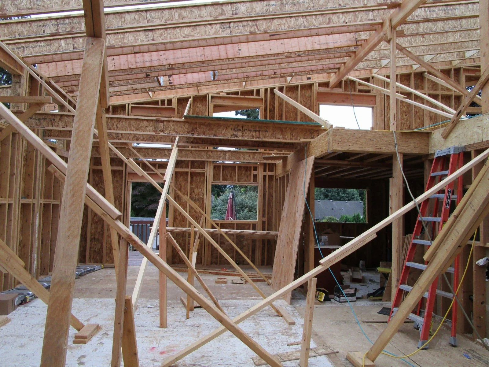 Lots of diagonal bracing as the roof rafters go on.