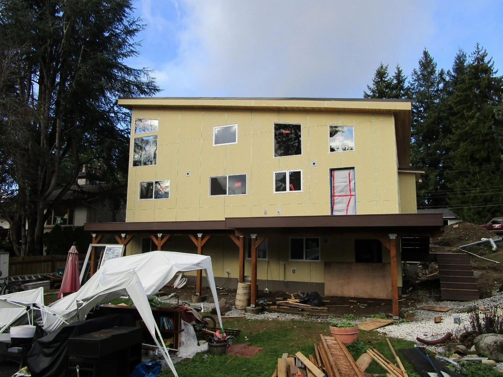 Back side of the house. A new deck replaces an old worn out deck.
