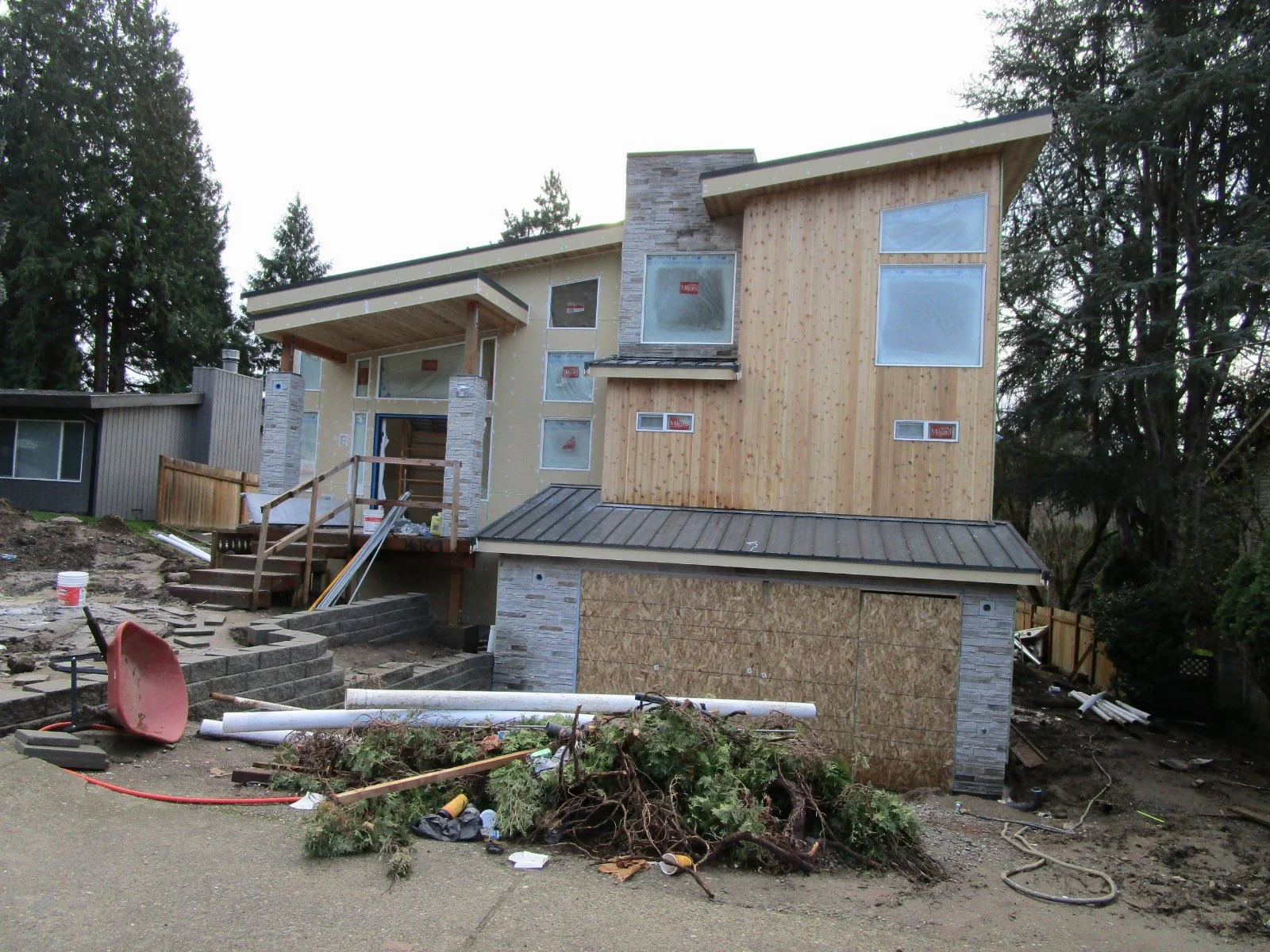 Siding materials start to go on.