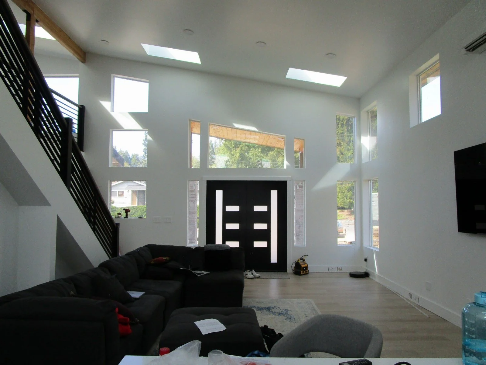 Stair handrails and other finish items being accomplished inside the main Great Room area.