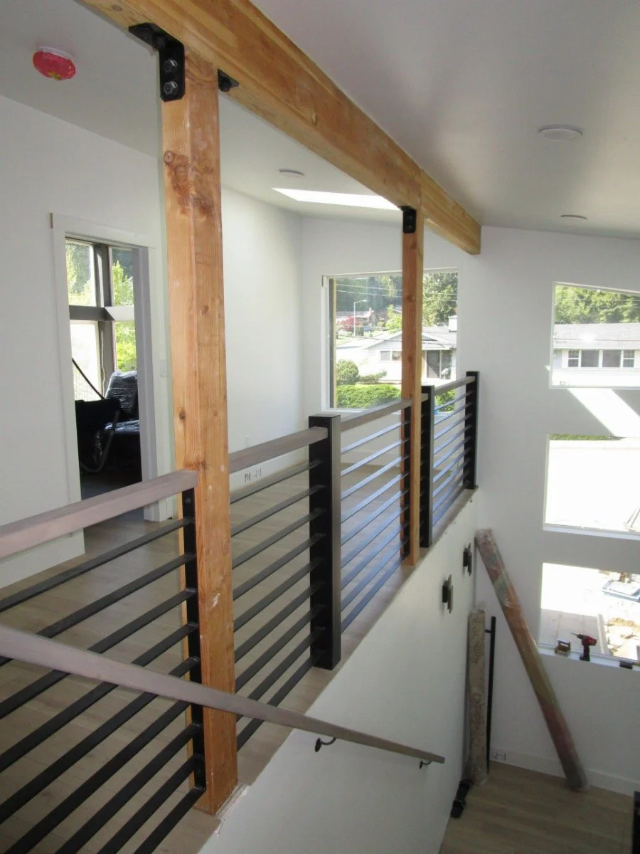 At the top of the stair landing. Light and airy.