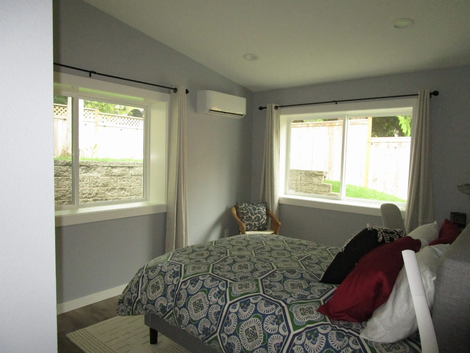 Bedroom with vaulted ceiling.