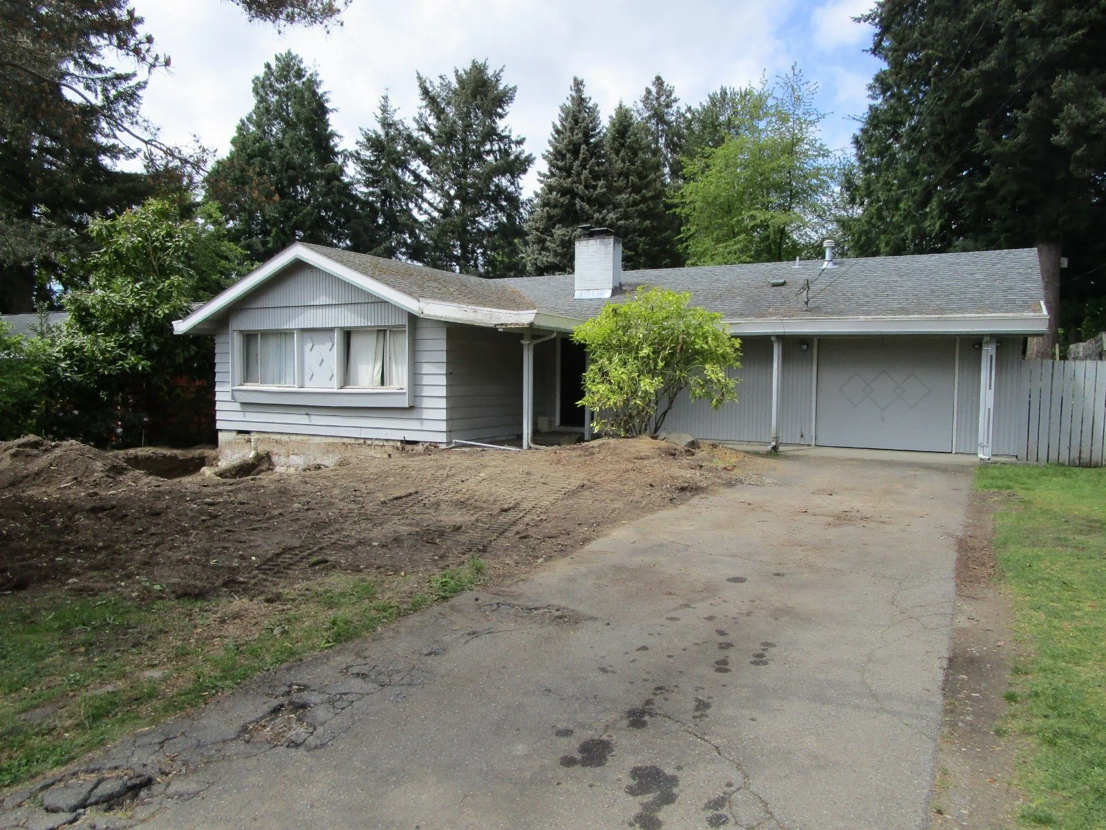 Trees removed, excavation for the front addition started.
