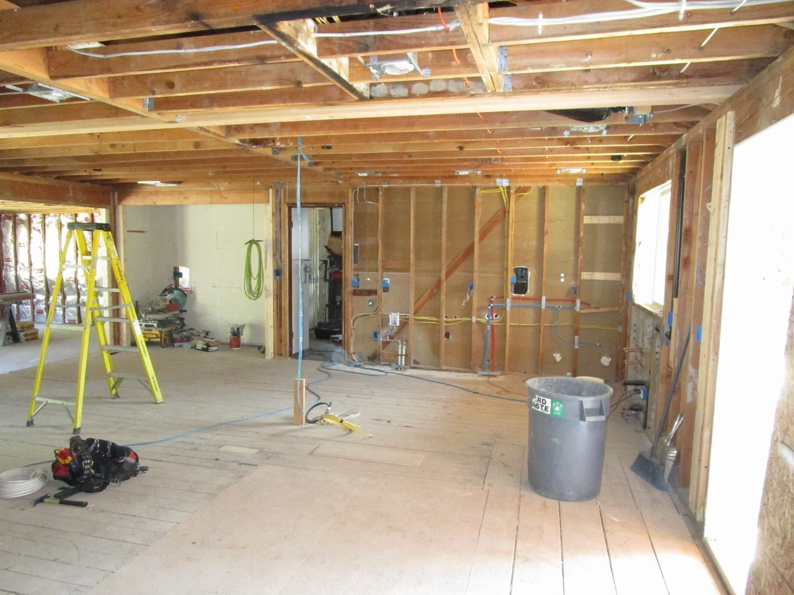 Electrical and plumbing rough in continues in the Great Room.