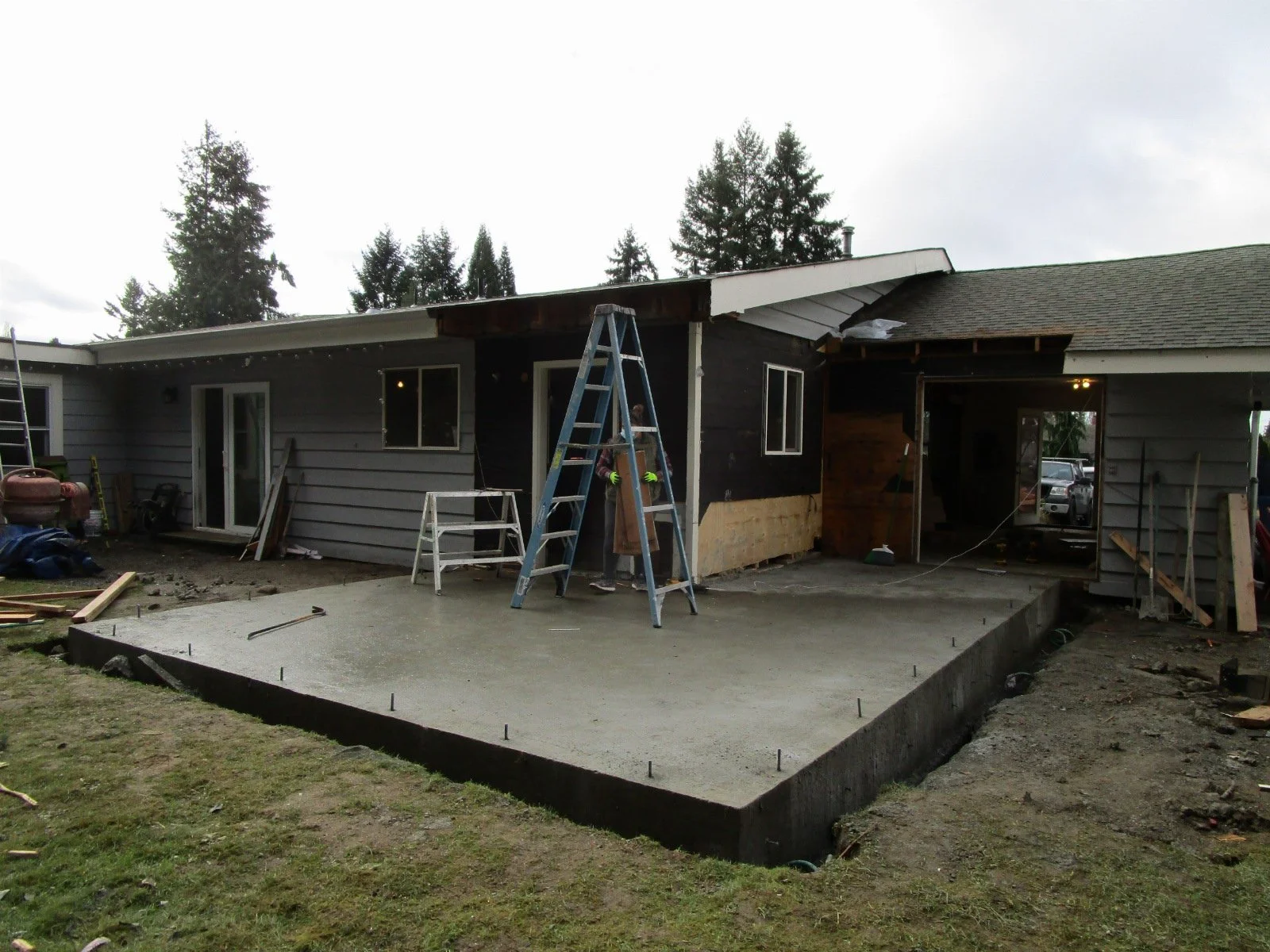 The slab is poured and curing for the bedroom addition.