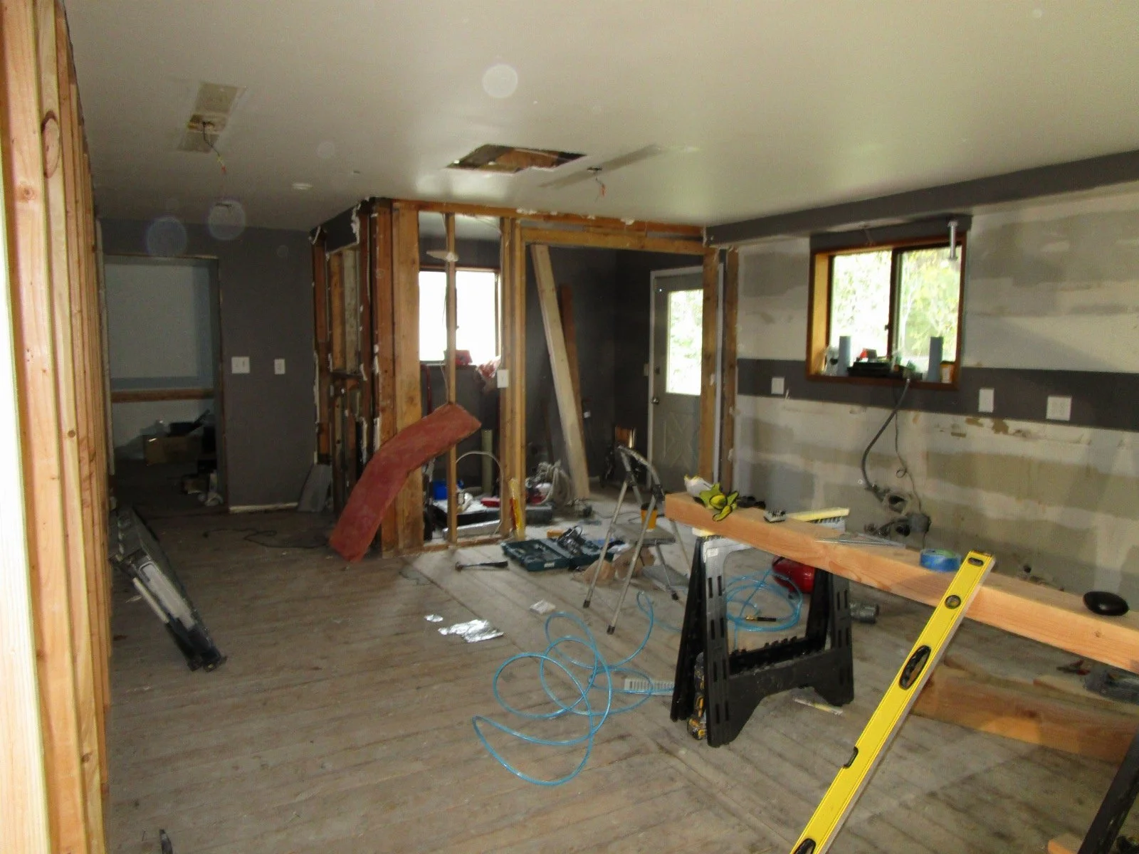Kitchen demo'd the change in direction of the subfloor shows the 10' prior addition.