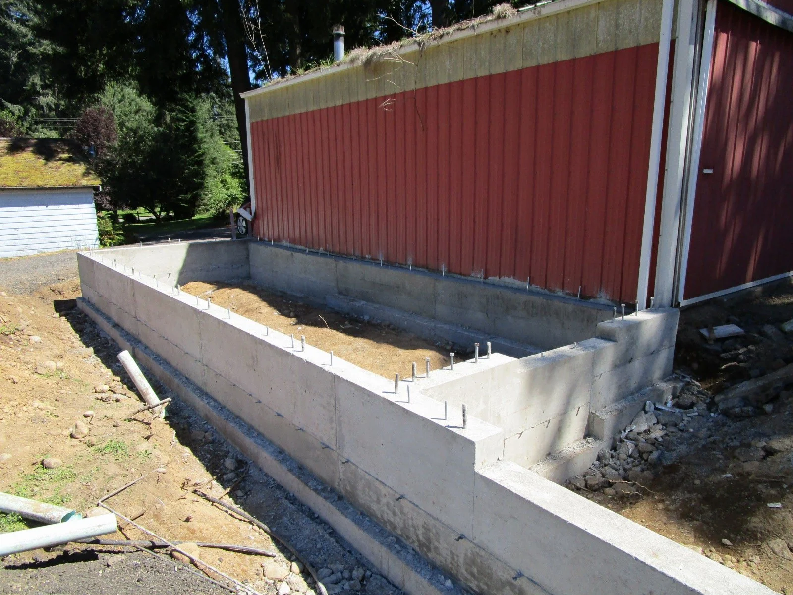A smaller workshop area off the larger garage space.