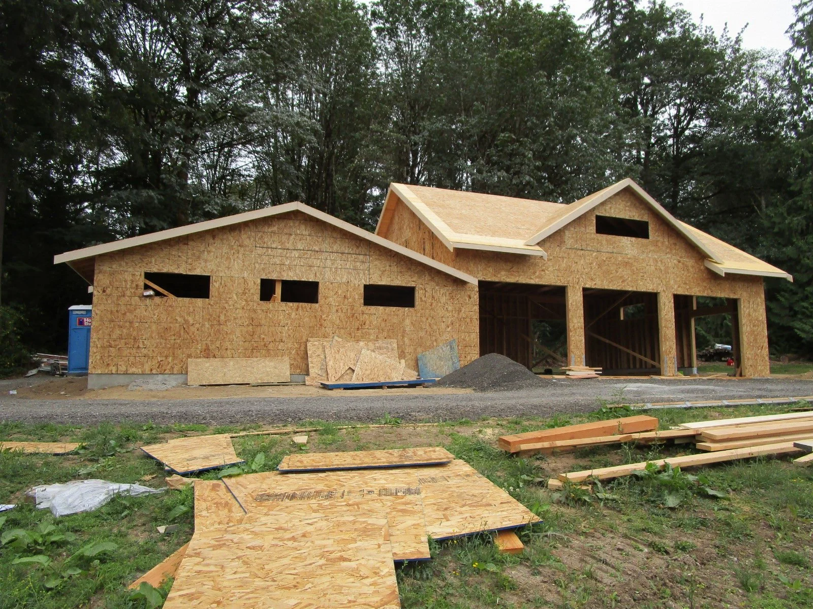 Old red shop is behind smaller addition on the left.