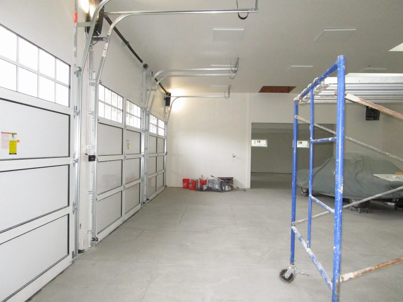 Interiors getting sheetrock and paint. Ready for a car lift.