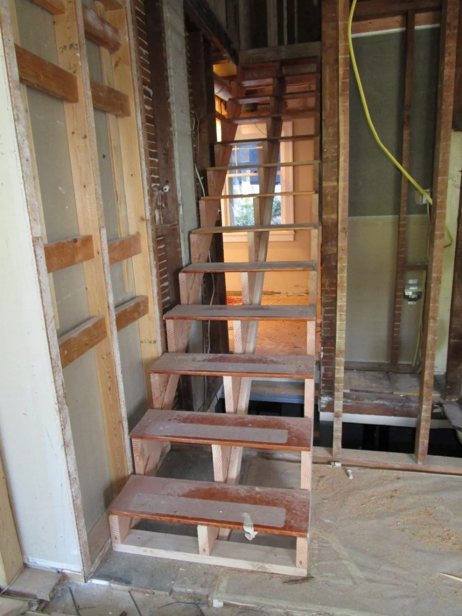 Demolition work starts and stairs meeting code are built.
