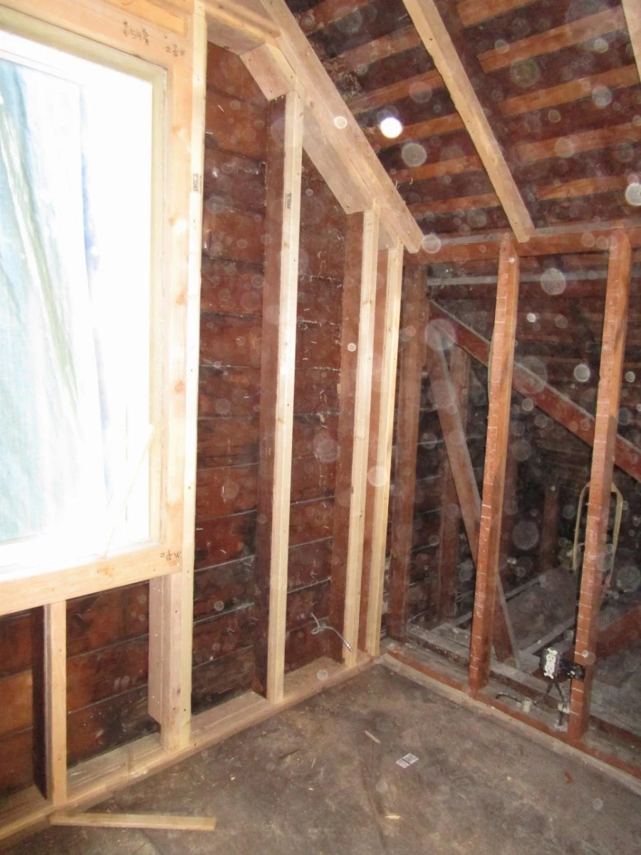 New window added and furring out walls to get a thick layer of batt insulation.