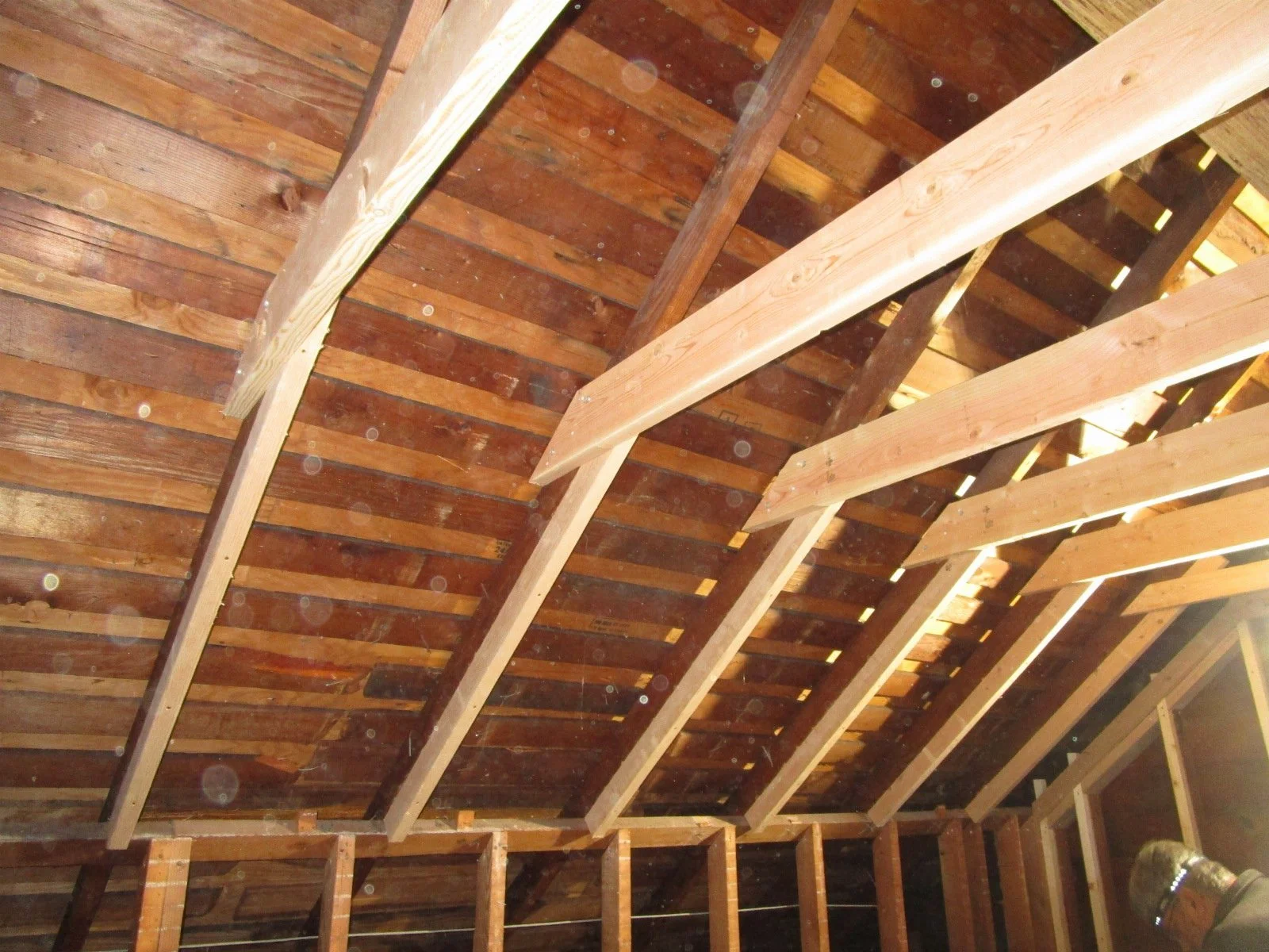 More framing, and furring out the 2x4 rafters to take more insulation.