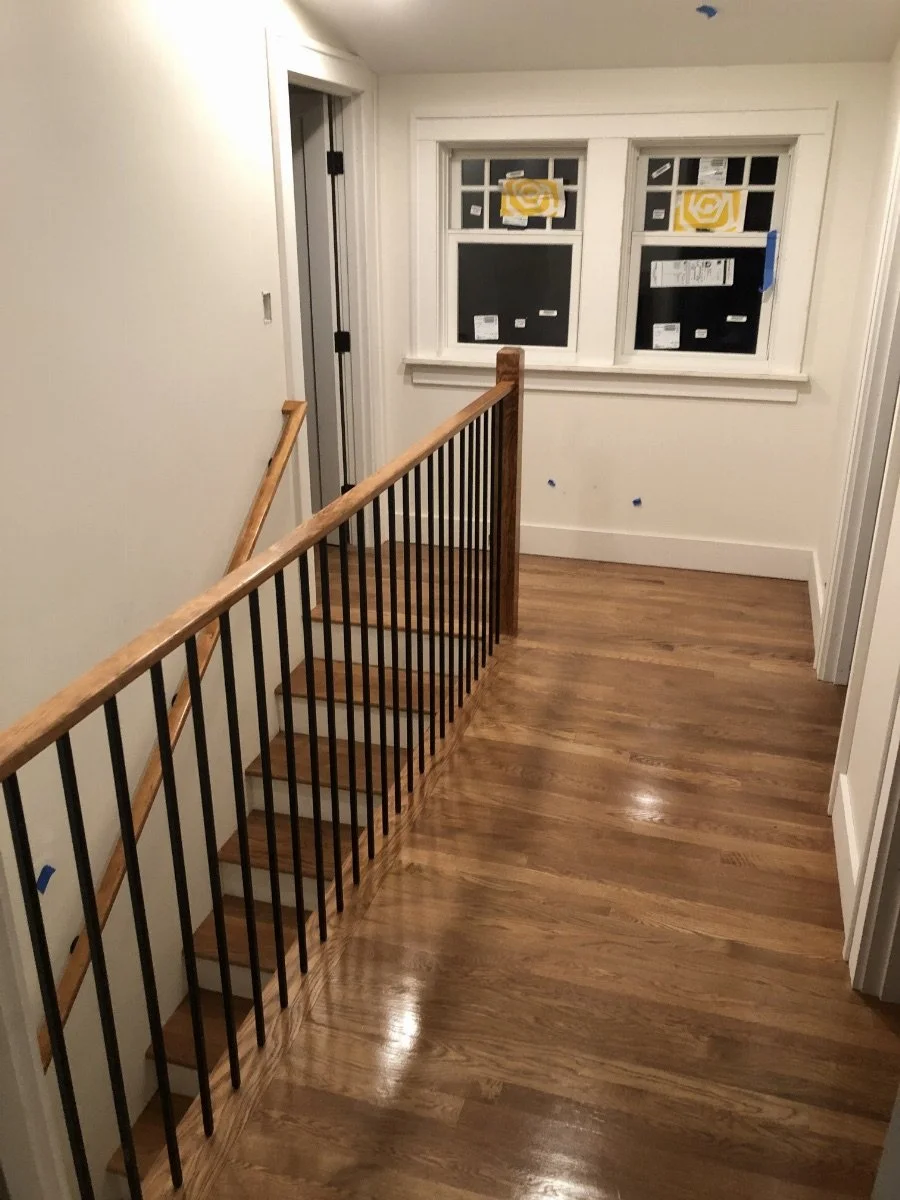 Top of stairs leading to the refurbished second floor rooms.