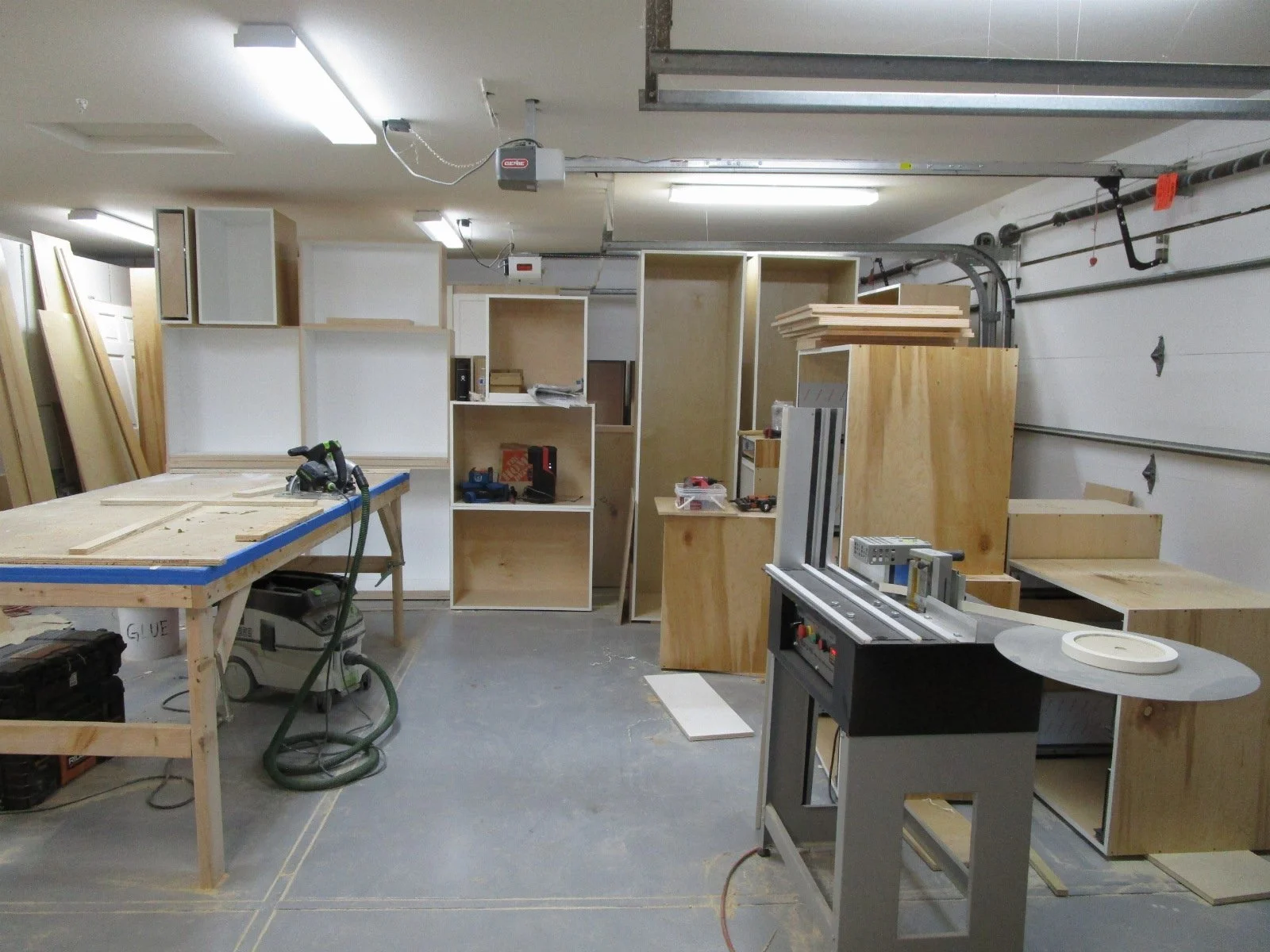 Over in the garage, the GC is building all of the cabinets on site. His guys are able to build the cabs at a lower cost versus cabinet shops.