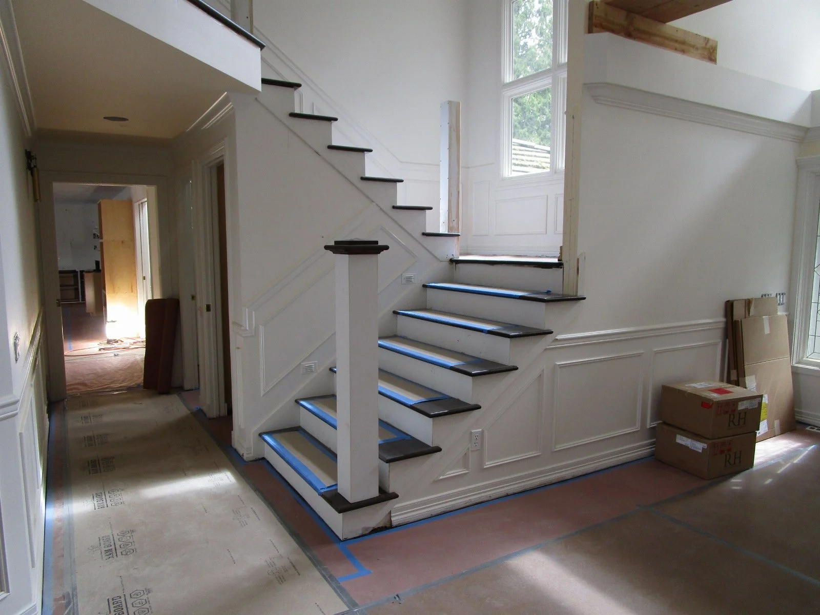 There's lots of other work going on around the house that is not part of the building permit work. Here the existing stairs are getting refinished and new handrail bits.