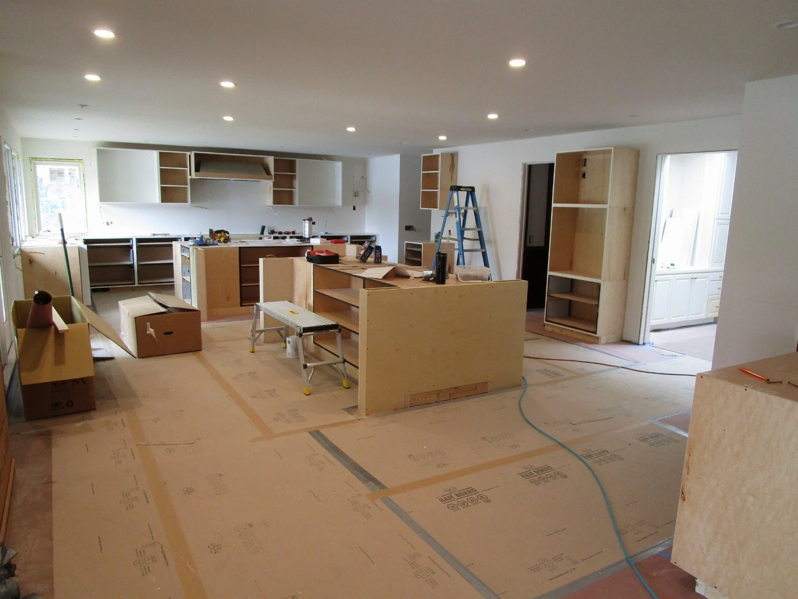 From the steps looking at the center island across to the kitchen, far wall.