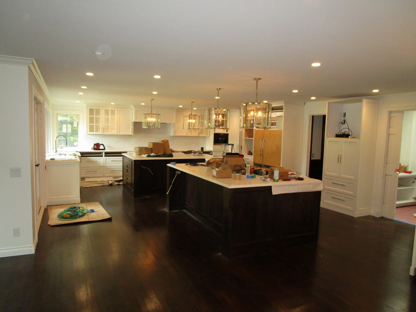 Cabinets in, down to finishing details. Remember how many walls were removed to open this up.