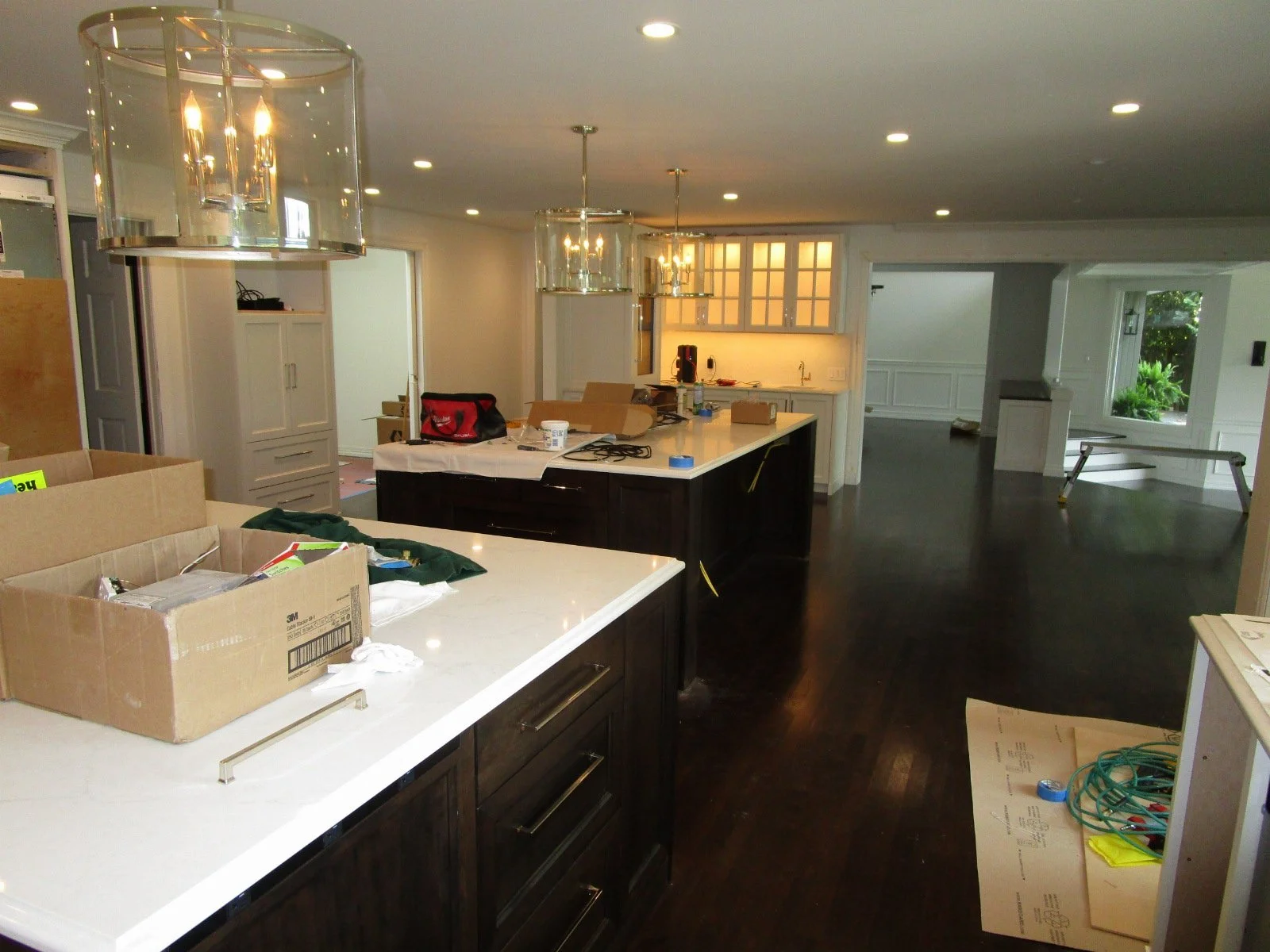 Standing at the kitchen looking back across the open space. There are new glu-lam beams galore up in the ceiling to support the second floor above, and end up with a flush ceiling.