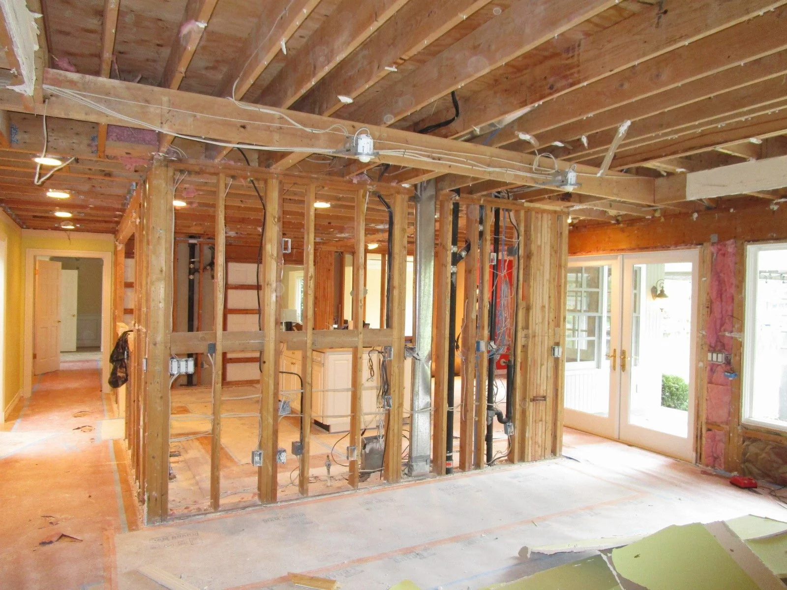 Looking back from new kitchen location, that whole sea of 2x4 studs will be coming out . Good times.