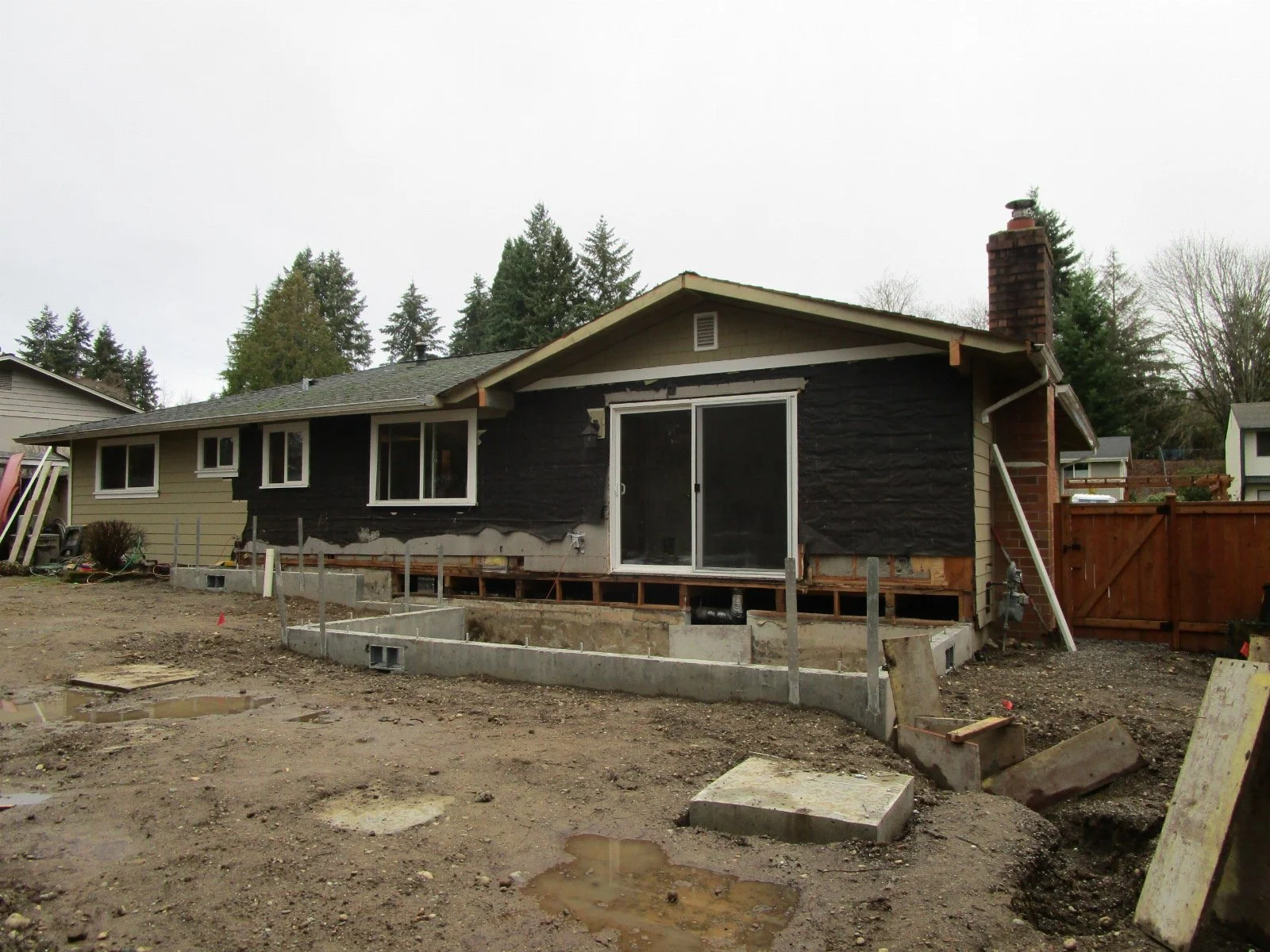 Concrete pads in the near ground are for deck posts.