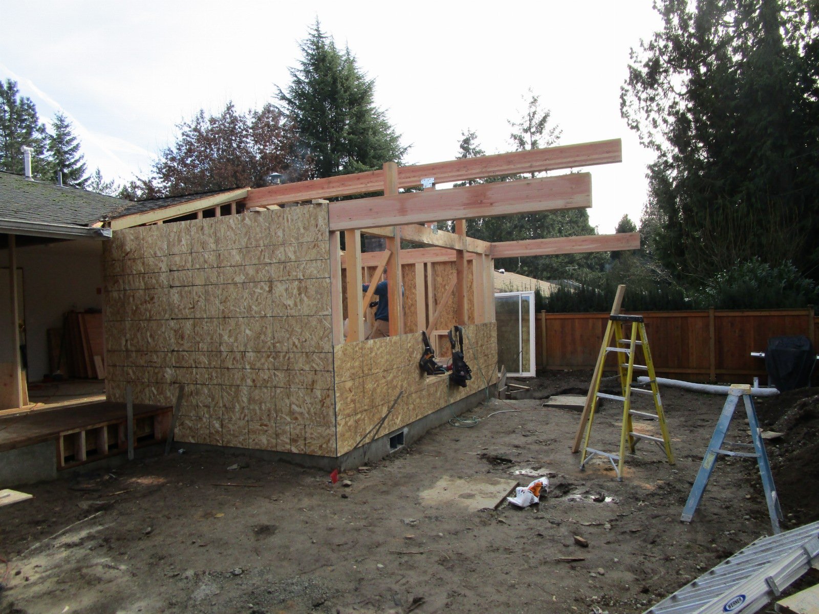 The cantilever beams were to have columns at the ends to support them. But to add the 4' bump to the bedroom mid project, we had to re-engineer the beams to be cantilever beams. This way without the p