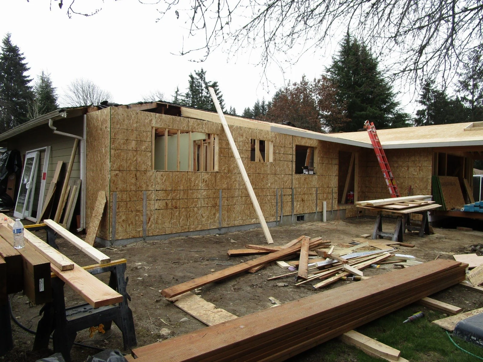 Outside, the 4-foot bump out of the corner bedroom posed problems for how to structure the roof, when the end of the roof has a hip, rather than a gable.