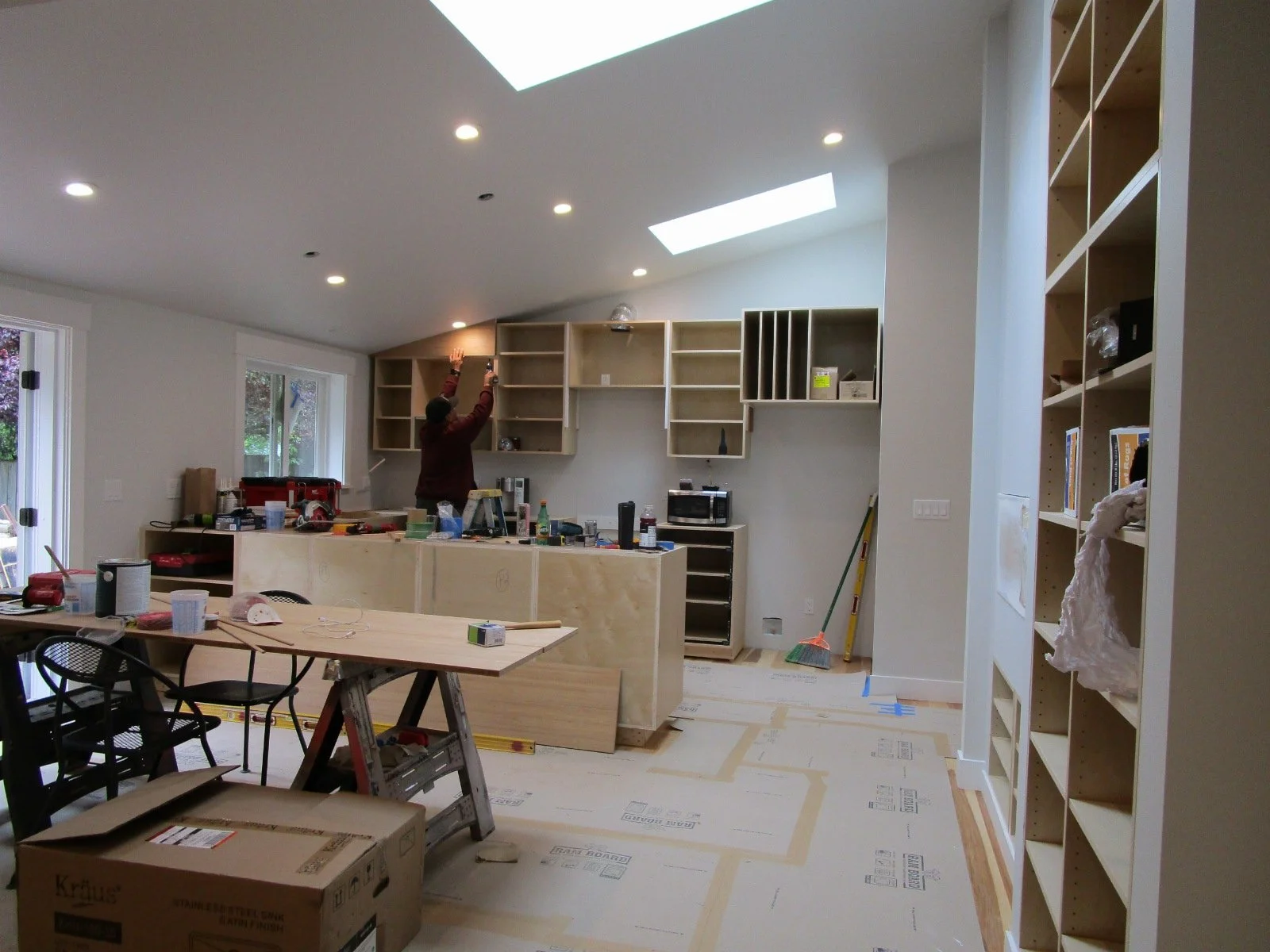 Kitchen cabinets are being built on site.