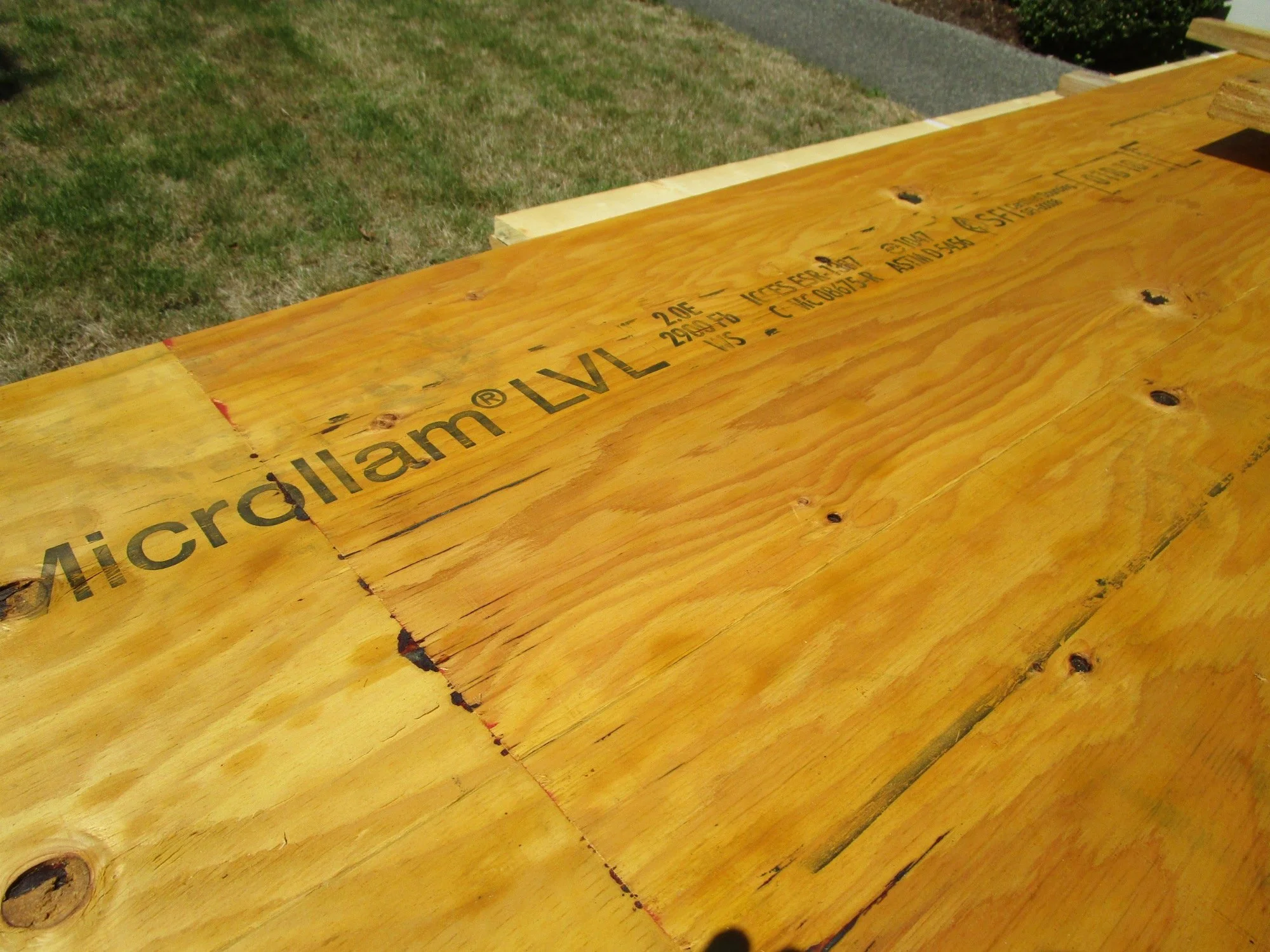 We are using Microllam LVL (Laminated Veneer Lumber) to reinforce existing glu-lam beams to make the combined beam stronger, so the beams can support the new second floor loads.