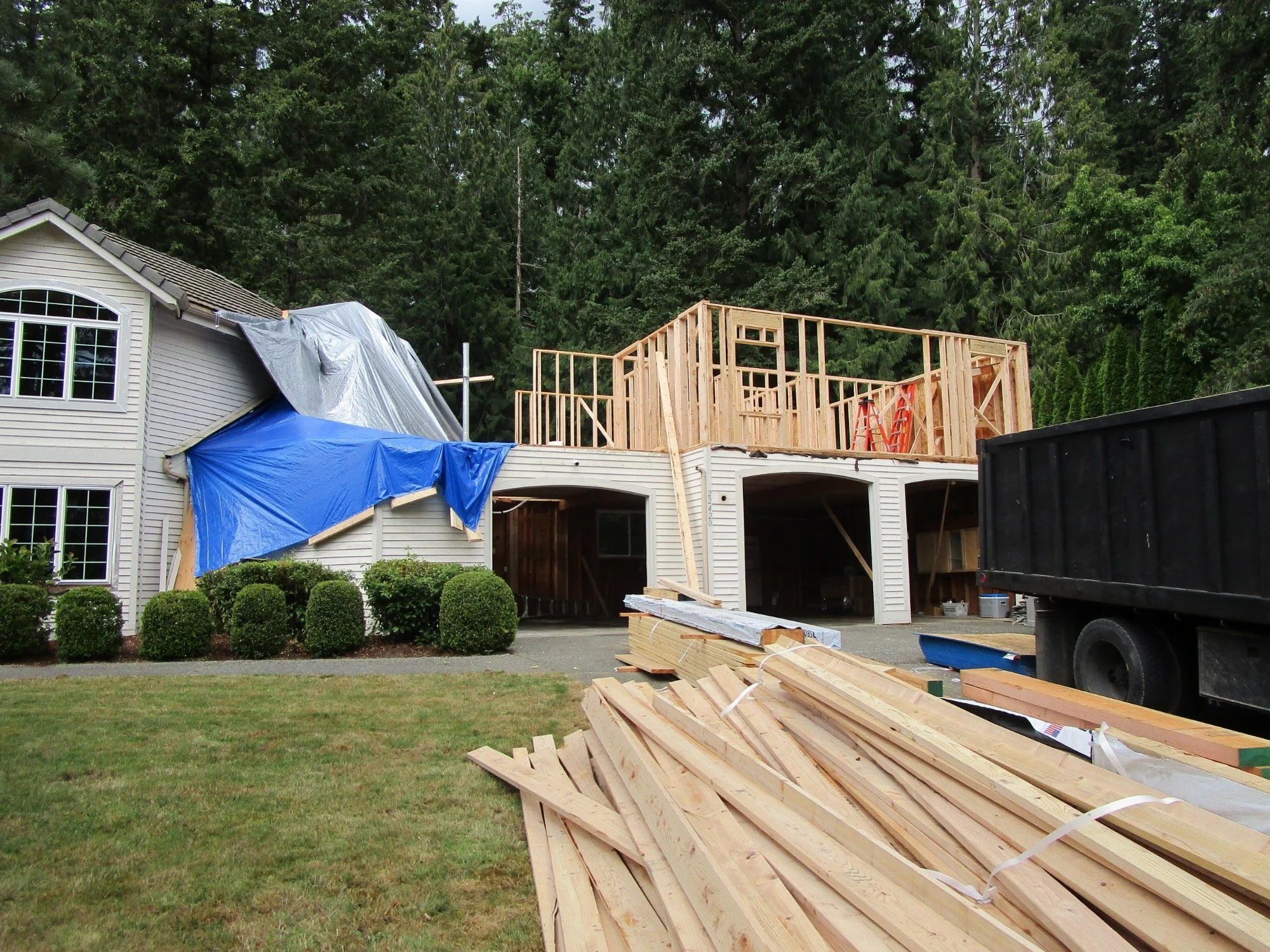 More lumber has been dropped, new second floor framing has started.