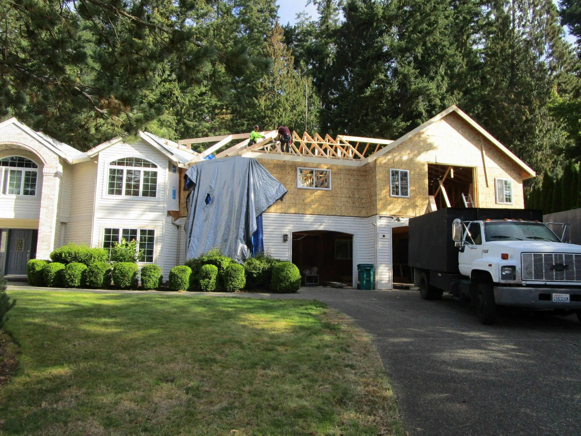 The new roof structure is a hybrid of pre-engineered roof trusses and more tedious stick framing. As much as we could we used trusses to control the gravity loads down to the existing foundation. Then