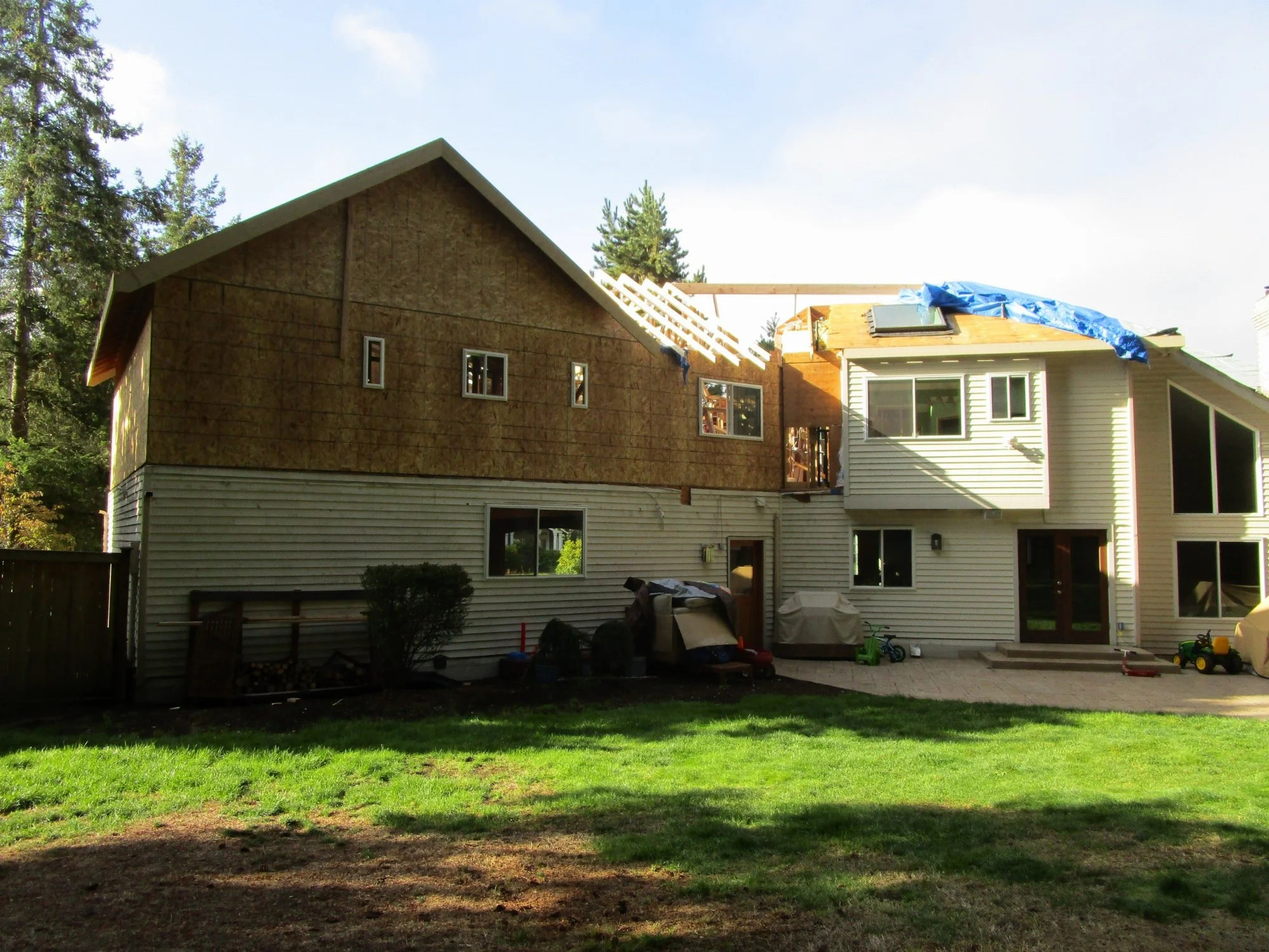 Here you can see a ridge beam up. Then they will frame off that to fill in over the transition portion.