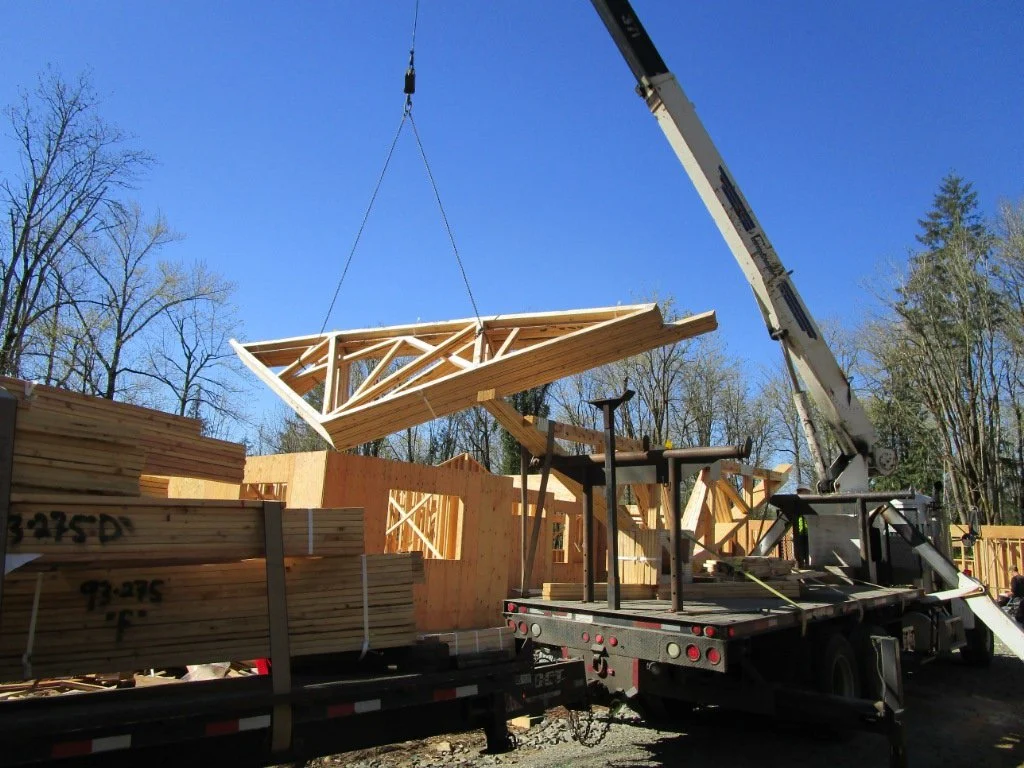 Truss packages being lifted to the right areas.