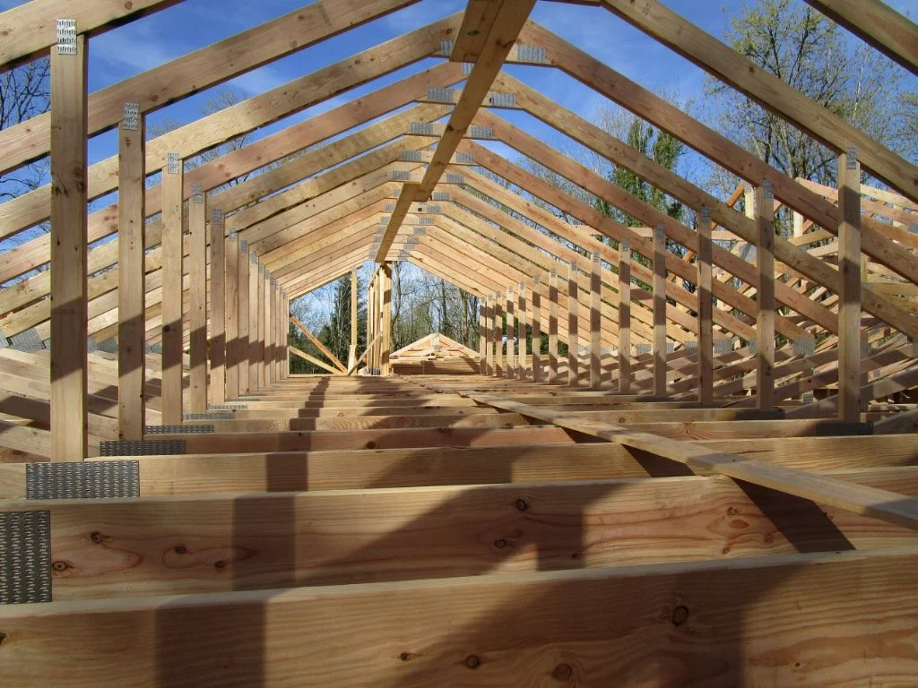 Very cool "Attic" truss over the garage. Truss designer is able to "carve out" the middle portion of the webing to form an open area for storage. This an open area about 8-feet wide and 5-feet tall at