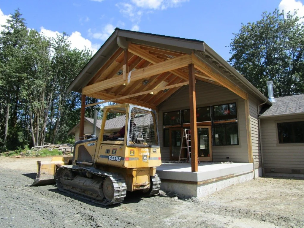Grader taking a break. They've been laying the fill down in 6" lifts then compacting.