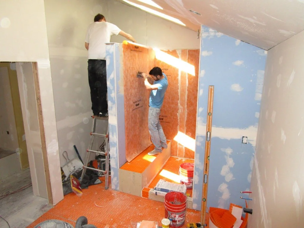 All of the orange on the horizontal surfaces is the substrate for the electric radiant heating. Even on the bench in the shower. Very nice.