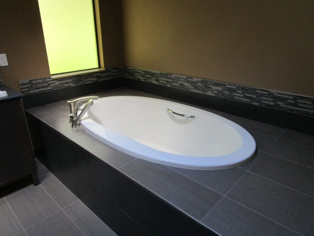 So the owners are in town and going to stay in the house for a week to test it out. Soaking tub is in with all the heated tile.