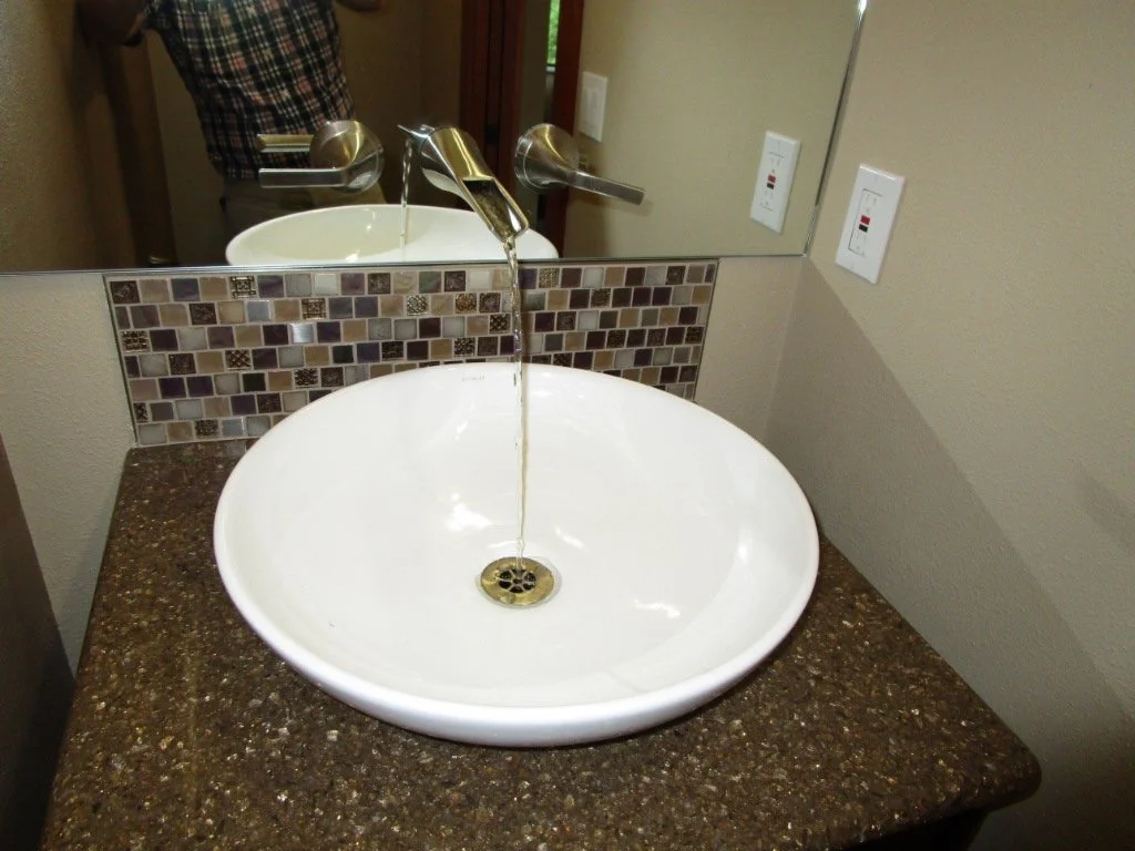 New powder room. Faucet come out of the glass. Very clever by the interior designer. I've learned that we may be doing more work on the house!