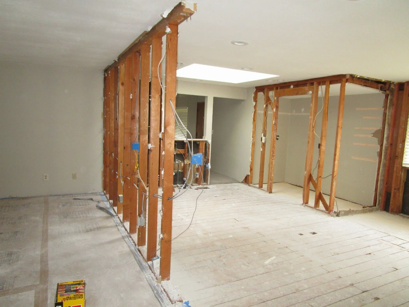 These bearing walls of exposed studs will get glu-lams over them. Then removed. 