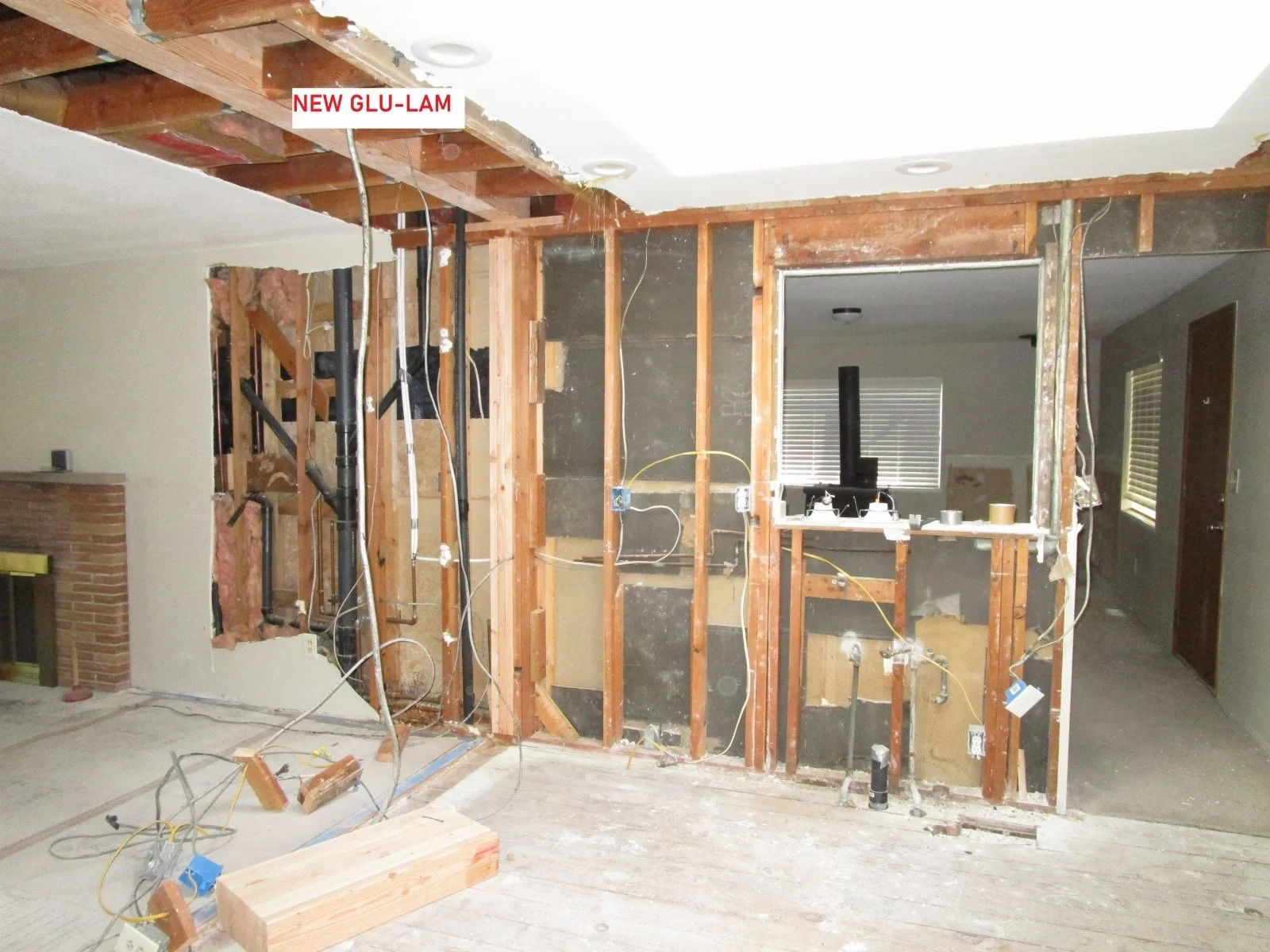 Glu-lam beams going in. Old walls gone.