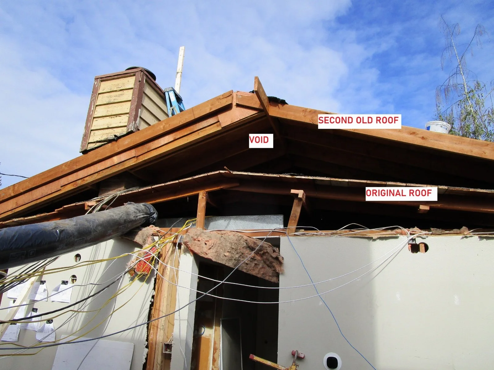 The original roof was low slope as shown. At some point when they reroofed they built a second roof over the first to get more slope. Crazy.